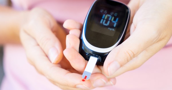 Person measures their blood sugar