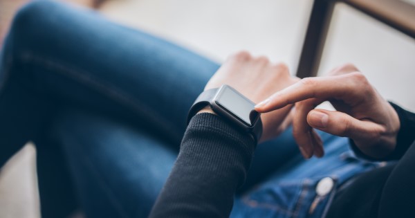 Person looking at smart watch on their wrist