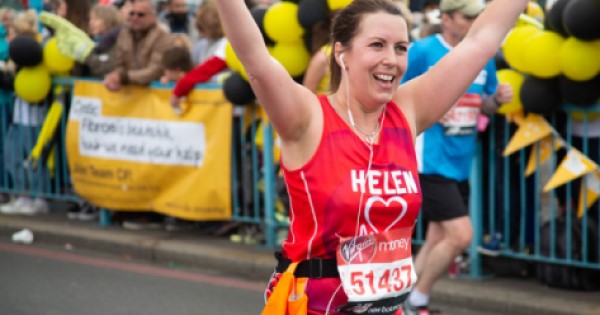 Woman running in British Heart Foundation running top 