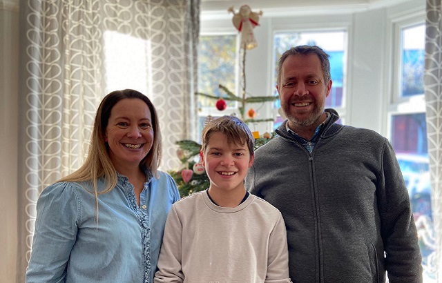 Louie with his mum Lottie and dad Karl Stokes