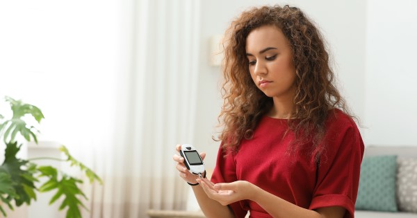 Woman checking blood sugar