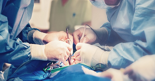 Surgeons performing heart surgery