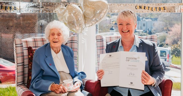 Picture of Joan Willett with her Point of Light award and carer Pauline Glenet