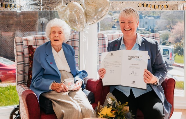 Picture of Joan Willett with her Point of Light award and carer Pauline Glenet