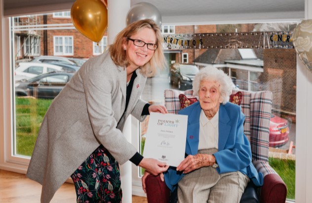 Picture of MP Sally-Ann Hart presenting Joan Willett with her point-of-light-award