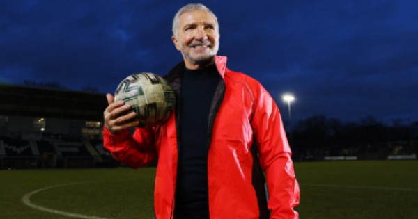Graeme Souness holding a football.