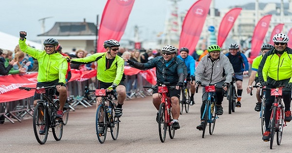 People riding bikes along Brighton seafront