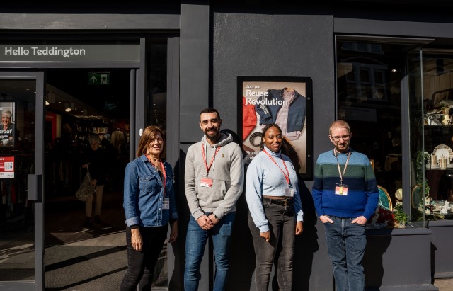 Four volunteers in front of a British Heart Foundation shop.