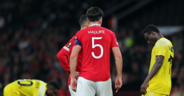 Harry Maguire wearing his Manchester United shirt on the pitch.