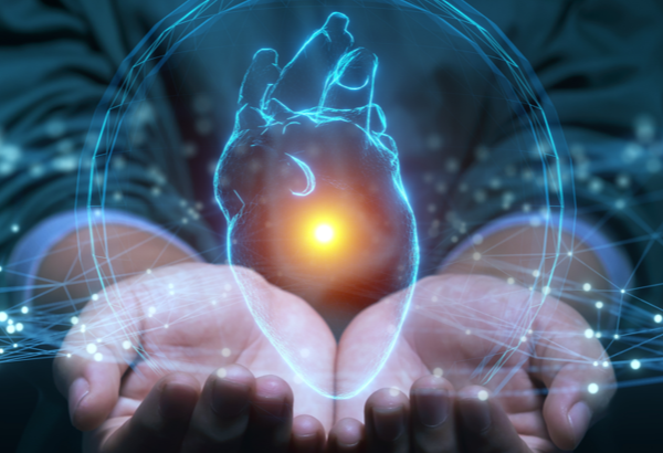 Hand holding the blue outline of a heart