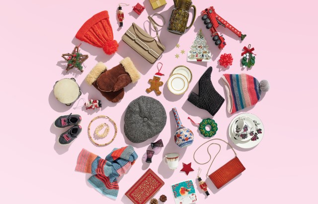 Christmas gifts in a circle on a pink background