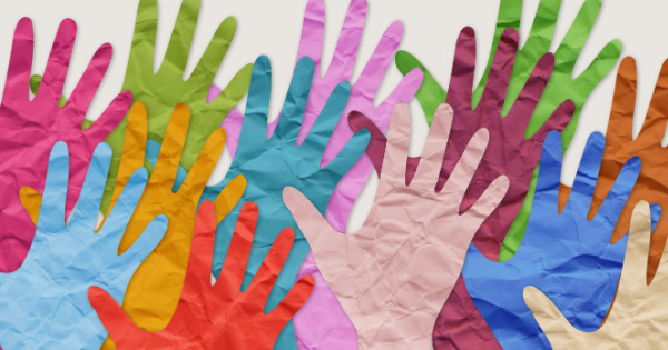 Collage of colourful paper hands as symbol of diversity and inclusion.