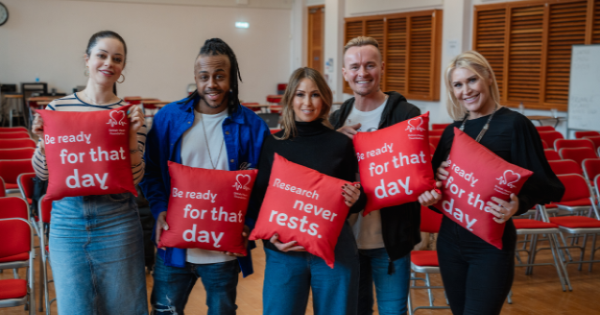 S Club posing with BHF cushions 