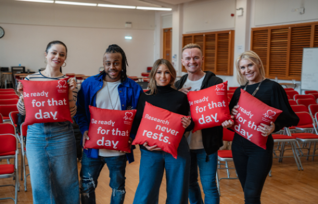S Club posing with BHF cushions 