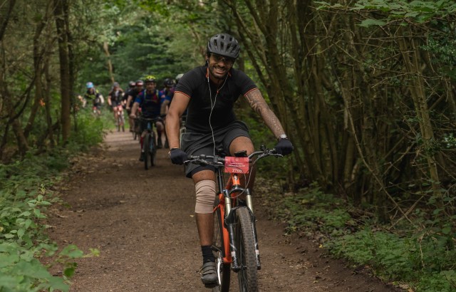 Man riding a mountain bike down a bridle path