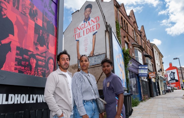 Nathan, Hayley and Carter outside a mural for Myles Christie