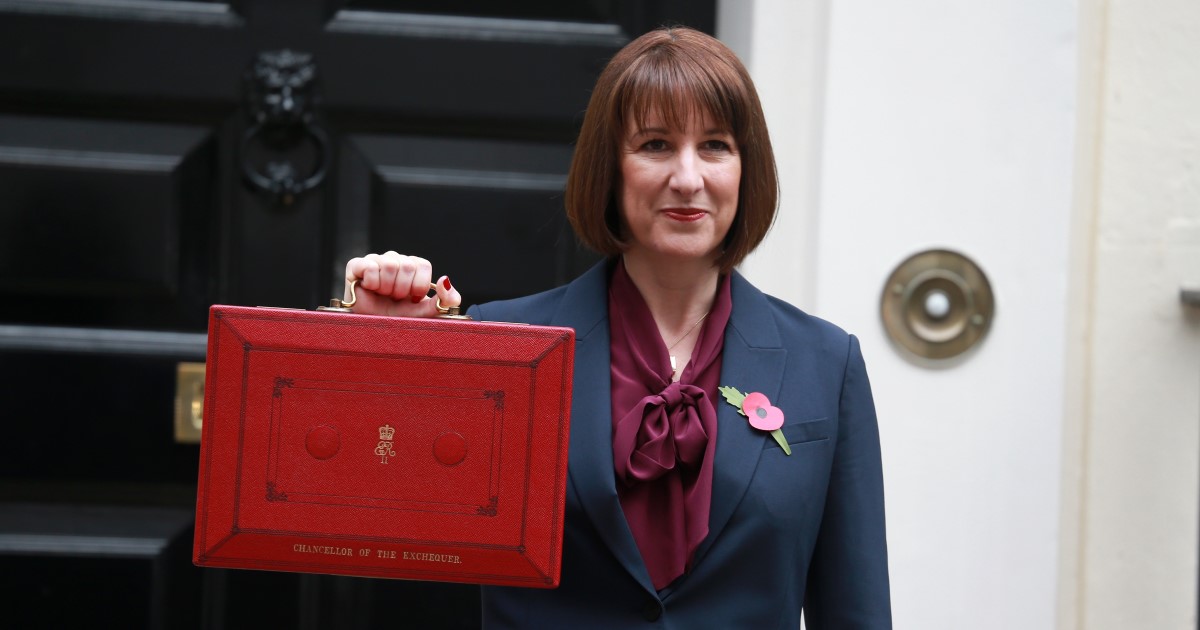 Photograph of Chancellor Rachel Reeves MP standing outside Number 11 Downing Street before delivering her Autumn Budget holding up the famous red briefcase
