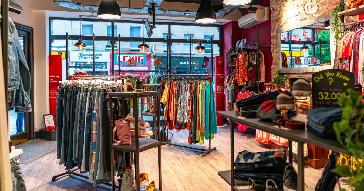 The inside of a British Heart Foundation, showing a variety of clothes