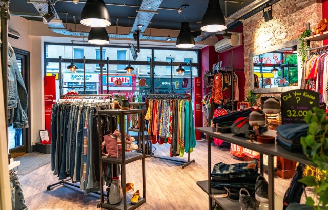 The inside of a British Heart Foundation, showing a variety of clothes