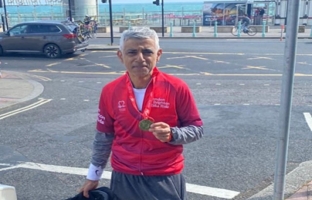London Mayor Sadiq Khan holding medal from London to Brighton 