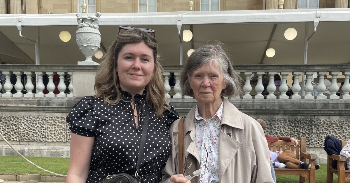 Grandmother and grandaughter arm in arm