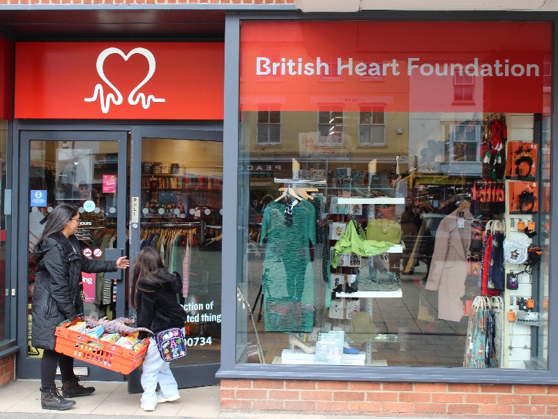 Maia Wiggett donating toys to her local BHF Shop