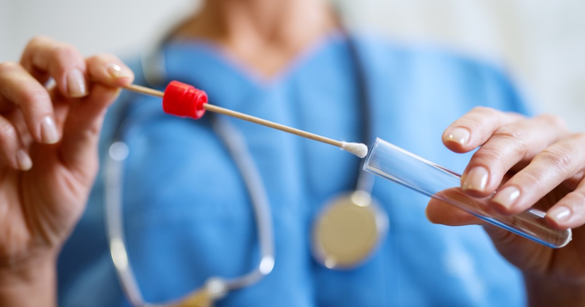 Doctor holding a cheek swab