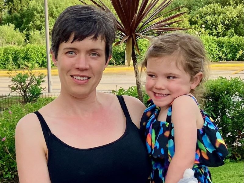 Becki holding her daughter, Remi
