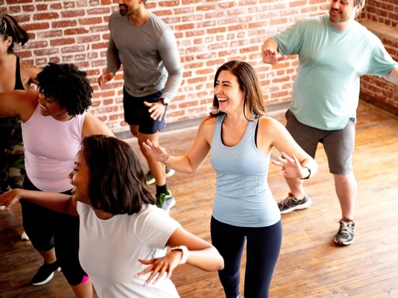 Stock photo of people having fun in a dance fitness class.