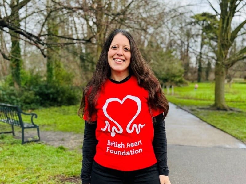 Dr Angeliki Asimaki stands in a park with a British Heart Foundation T-shirt on