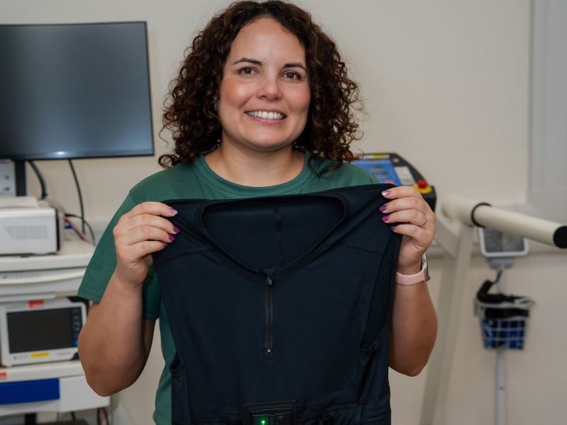 Carly holding T-shirt