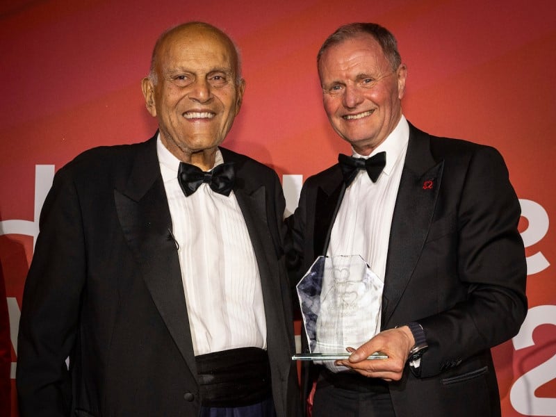 Picture of Sir Professor Magdi Yacoub on stage accepting his life time achievement award from Chief Scientific and Medical Officer BHF Professor Bryan Williams