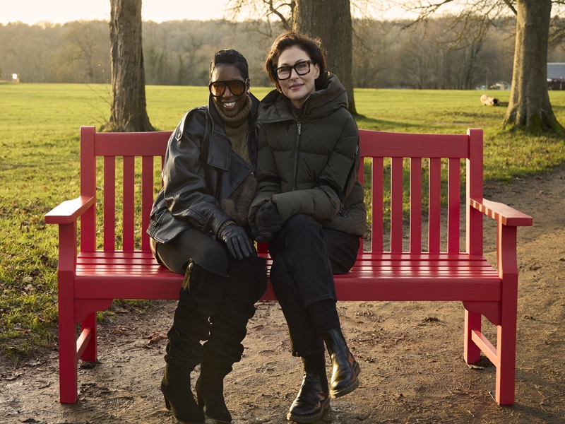TV presenter Emma Willis sits on a BHF red bench with cardiovascular disease survivor Michelle White