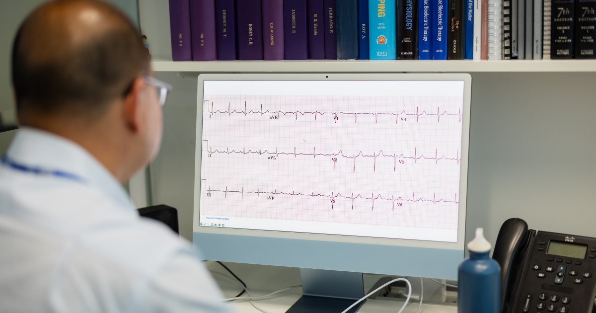 Looking over Dr Ng's shoulder as he looks at an ECG recording on a computer screen