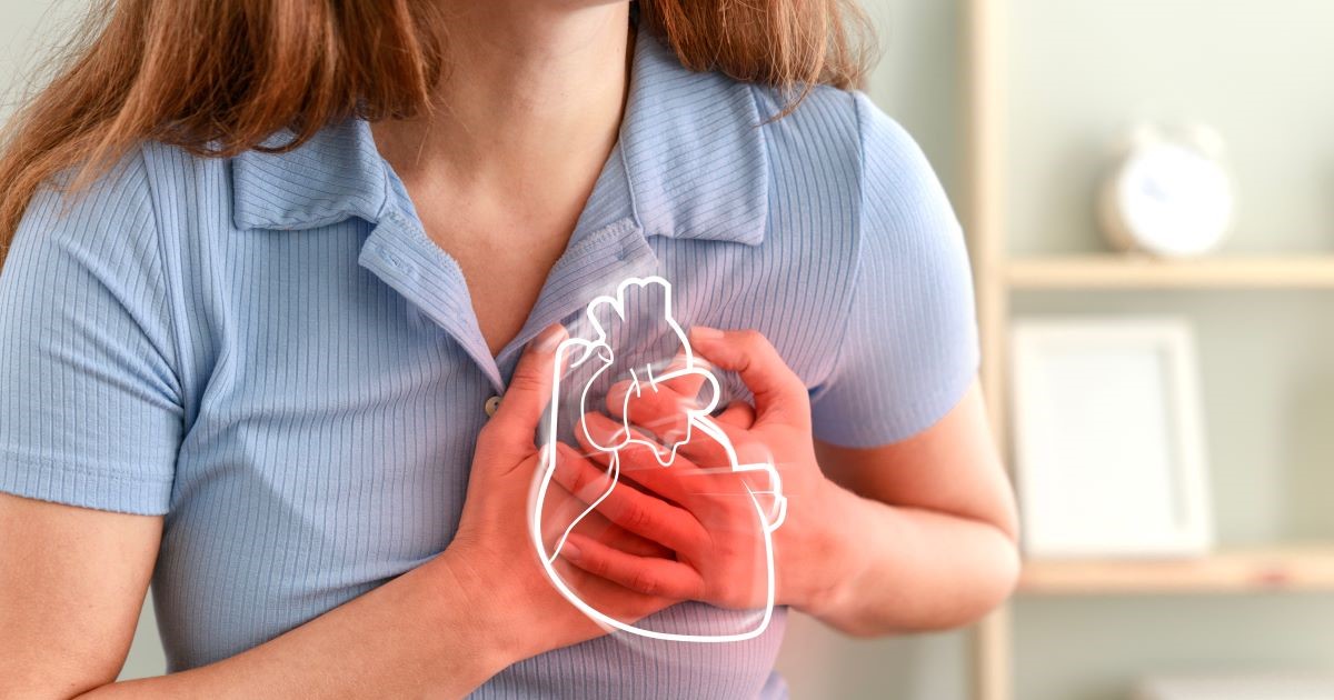 Woman in pain clutching her chest