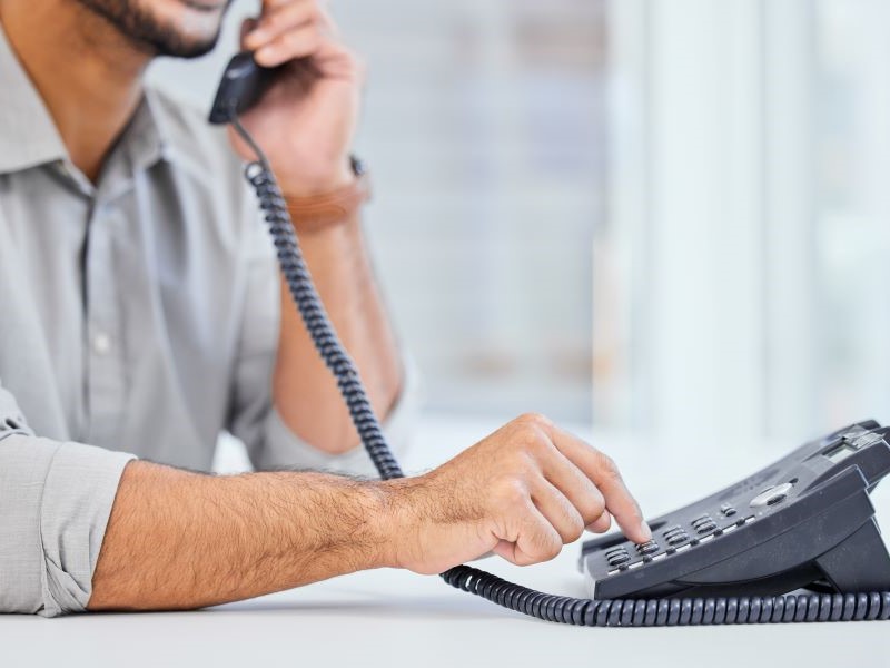 Pharmacist calling a patient