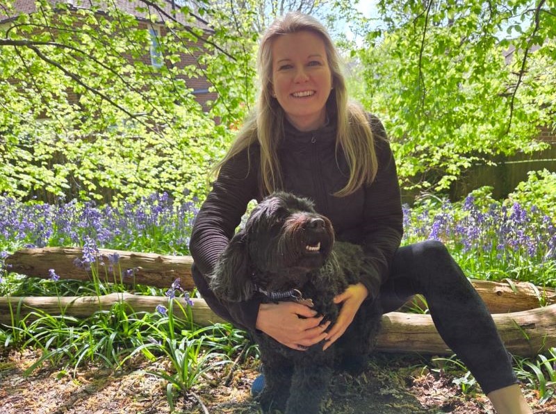 Sarah Hall smiling with her dog