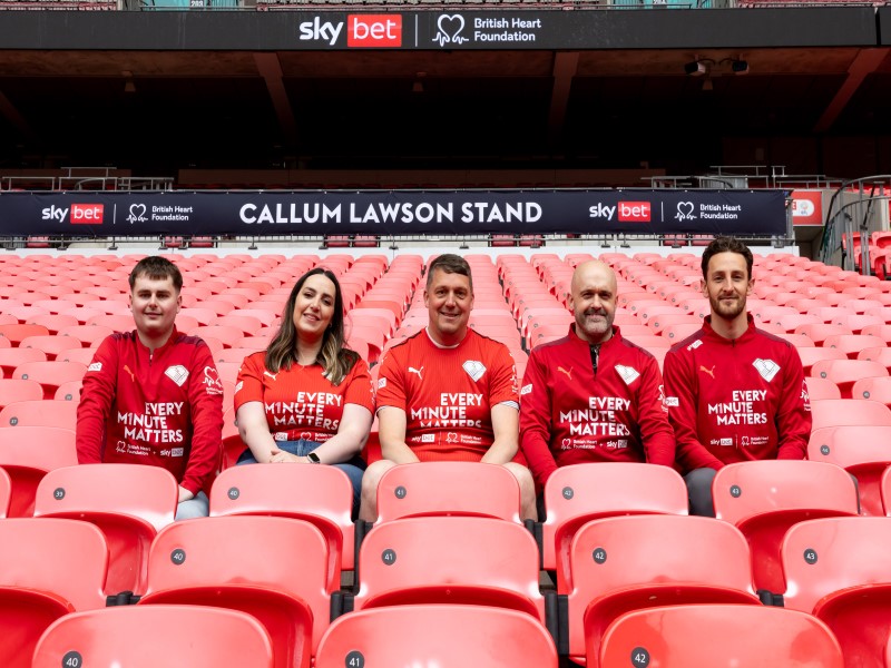 Callum Lawson, Pippa Sharman, Ed McCann, Andy Wall and Tom Lockyer sitting in the renamed stands at Wembley Stadium