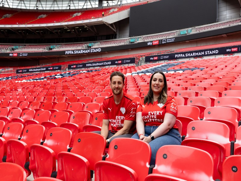 Tom Lockyer Pippa Sharman sitting in the renamed stands at Wembley Stadium