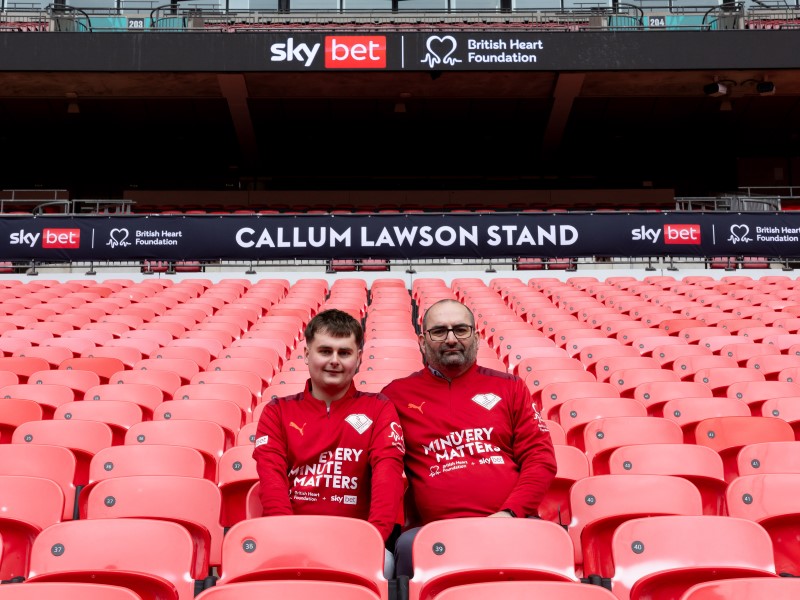Callum Lawson and Darren Lawson sitting in the renamed stands at Wembley Stadium