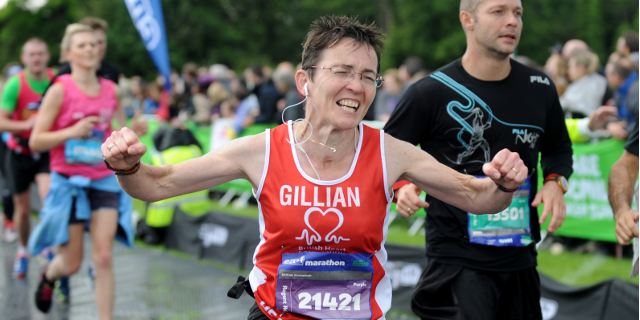 Ecstatic lady at the finish line of a run.