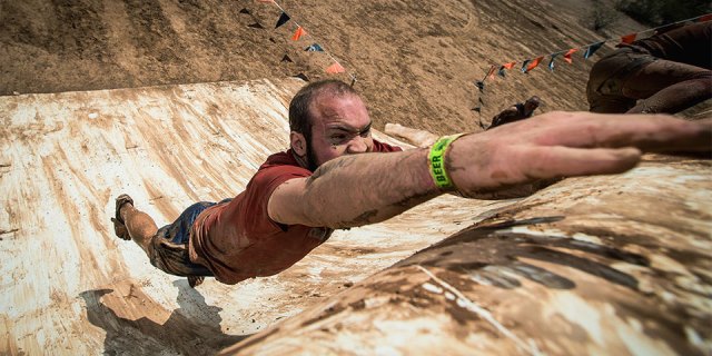Tough Mudder jumping up obsticle