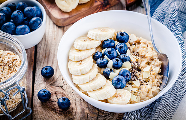 Porridge topped with bananas and blueberries
